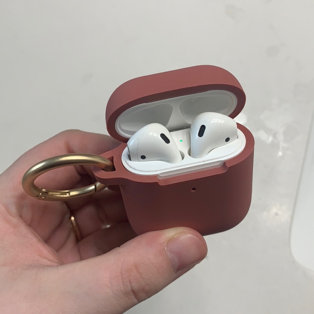 Apple AirPods with clip-on case - no charging cord